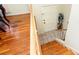 Wooden staircase leads to the tiled foyer and a front door with nearby hardwood flooring at 2831 Carolyn Se Dr, Smyrna, GA 30080