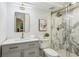 Modern bathroom with marble shower, sleek vanity, and gold fixtures at 1240 Woodland Ne Ave # 7, Atlanta, GA 30324