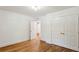 Spacious bedroom featuring hardwood floors and a closet with double doors at 1240 Woodland Ne Ave # 7, Atlanta, GA 30324