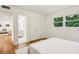 Bedroom with hardwood floors and a bright window view overlooking the neighborhood at 1240 Woodland Ne Ave # 7, Atlanta, GA 30324