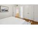 Bedroom with hardwood floors, closet with double doors and view to the bathroom at 1240 Woodland Ne Ave # 7, Atlanta, GA 30324