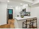 Eat-in kitchen features white cabinets, a stylish backsplash, and stainless steel appliances at 1240 Woodland Ne Ave # 7, Atlanta, GA 30324