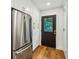 Pantry area with stainless steel refrigerator and hardwood floors at 1240 Woodland Ne Ave # 7, Atlanta, GA 30324