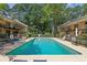 Community pool with lush landscaping and lounge seating at 1240 Woodland Ne Ave # 7, Atlanta, GA 30324