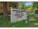 Sign for Heathwood Gardens Condominiums features vintage brick and landscaping at 1240 Woodland Ne Ave # 7, Atlanta, GA 30324
