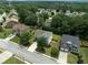 Aerial view of a home and its neighborhood with mature trees and well-maintained lawns at 1722 Preserve Creek Way, Loganville, GA 30052