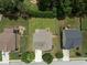 Top-down aerial shot of a house in a fenced backyard with fire pit and patio between neighboring houses at 1722 Preserve Creek Way, Loganville, GA 30052