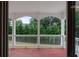 This is a balcony that overlooks the backyard. It has white railing and wooden floors at 1722 Preserve Creek Way, Loganville, GA 30052