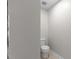 Bright bathroom with a toilet and neutral paint colors at 1722 Preserve Creek Way, Loganville, GA 30052