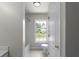 Bathroom featuring a shower/tub combo and window at 1722 Preserve Creek Way, Loganville, GA 30052