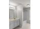 Bathroom with a double sink vanity, bathtub, and shower in neutral tones at 1722 Preserve Creek Way, Loganville, GA 30052