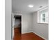 Bright bedroom with hardwood floors and closet at 1722 Preserve Creek Way, Loganville, GA 30052
