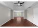 Primary bedroom featuring tray ceiling, ceiling fan, and hardwood floors at 1722 Preserve Creek Way, Loganville, GA 30052