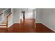 Elegant foyer showcasing hardwood floors, wainscoting, and a staircase with wood railings at 1722 Preserve Creek Way, Loganville, GA 30052