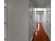 Long hallway featuring hardwood floors and wainscoting detail at 1722 Preserve Creek Way, Loganville, GA 30052