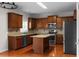 Well-equipped kitchen with stainless steel appliances, an island, and granite countertops at 1722 Preserve Creek Way, Loganville, GA 30052