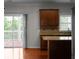 Open kitchen with an island, stainless appliances, and access to outdoor deck at 1722 Preserve Creek Way, Loganville, GA 30052