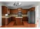 Well-equipped kitchen with stainless steel appliances, an island, and granite countertops at 1722 Preserve Creek Way, Loganville, GA 30052