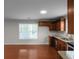 Bright eat-in kitchen featuring stainless steel appliances, wood cabinets, and plenty of counter space at 1722 Preserve Creek Way, Loganville, GA 30052