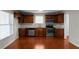 Eat-in kitchen featuring stainless steel appliances, wood cabinets, and plenty of counter space at 1722 Preserve Creek Way, Loganville, GA 30052