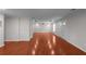 Spacious living room with hardwood floors and neutral paint, ready for your personal touch at 1722 Preserve Creek Way, Loganville, GA 30052
