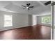 Large primary bedroom with a trey ceiling, a ceiling fan, and wood floors at 1722 Preserve Creek Way, Loganville, GA 30052