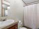 Simple bathroom with a vanity, toilet, and shower curtain at 2567 Hancock Rd, Social Circle, GA 30025
