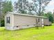 Charming single-story home with light siding, green lawn, and a small deck for outdoor enjoyment at 2567 Hancock Rd, Social Circle, GA 30025