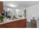 Open kitchen with granite countertops and modern appliances at 2567 Hancock Rd, Social Circle, GA 30025