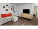 Comfortable living room with a couch, ottoman, and decoratively adorned wall at 2567 Hancock Rd, Social Circle, GA 30025