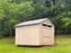 Backyard shed for storage in a yard with green grass at 2567 Hancock Rd, Social Circle, GA 30025
