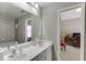 Well-lit bathroom with double sink vanity and separate tub/shower at 4171 Lantern Hill Dr, Dacula, GA 30019