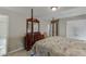 Spacious bedroom featuring a decorative bed frame, carpeted floor and walk in closet at 4171 Lantern Hill Dr, Dacula, GA 30019