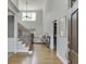 Elegant foyer with hardwood floors, a staircase, and natural light from a large window at 4171 Lantern Hill Dr, Dacula, GA 30019