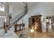 Spacious foyer with hardwood floors, staircase, and natural light from a front door transom at 4171 Lantern Hill Dr, Dacula, GA 30019