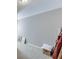 Bright hallway with neutral carpet, natural light, and grey painted walls at 4171 Lantern Hill Dr, Dacula, GA 30019