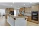 Modern kitchen featuring light wood cabinets, granite counters, and stainless steel appliances at 4171 Lantern Hill Dr, Dacula, GA 30019