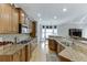 Modern kitchen with granite countertops, stainless steel appliances, and ample cabinet space at 4171 Lantern Hill Dr, Dacula, GA 30019