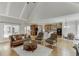 Open concept living room with hardwood floors leading to a modern kitchen and breakfast nook at 4171 Lantern Hill Dr, Dacula, GA 30019
