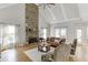 Bright living room featuring a floor-to-ceiling stone fireplace and vaulted ceilings at 4171 Lantern Hill Dr, Dacula, GA 30019