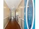 Hallway with tan walls and a unique brown and red patterned floor leading towards a blue front door at 6889 Kingsboro Dr, Lithia Springs, GA 30122