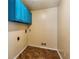 Laundry room featuring linoleum flooring and blue cabinets for storage at 6889 Kingsboro Dr, Lithia Springs, GA 30122