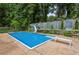 Fenced in-ground pool featuring a diving board and a slide surrounded by a well-kept lawn at 6889 Kingsboro Dr, Lithia Springs, GA 30122