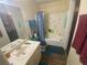 Well-lit bathroom featuring a sink, toilet and shower/tub combination at 8951 Stonebridge Blvd, Douglasville, GA 30134