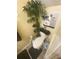 Compact bathroom featuring a toilet, storage, and unique decor at 8951 Stonebridge Blvd, Douglasville, GA 30134