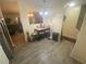 Cozy dining area featuring modern laminate flooring adjacent to the kitchen space at 8951 Stonebridge Blvd, Douglasville, GA 30134