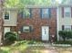 Charming brick townhome with green shutters and a cozy front yard at 8951 Stonebridge Blvd, Douglasville, GA 30134
