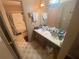 Bathroom with a vanity, sink, mirror, and a shower/tub combination with a patterned shower curtain at 8957 Stonebridge Blvd, Douglasville, GA 30134