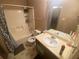 Bathroom featuring vanity with sink and mirror, toilet, and shower/tub combination with curtain at 8957 Stonebridge Blvd, Douglasville, GA 30134
