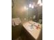 Cozy bathroom featuring a well-lit vanity, sink, and mirror at 8957 Stonebridge Blvd, Douglasville, GA 30134